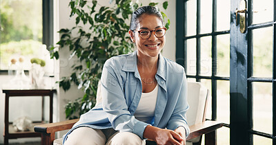 Buy stock photo Happy woman, portrait and psychologist with chair in home for remote work or mental health service. Female person, counselor or smile with pride for therapy help or professional advice in house