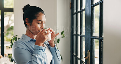 Buy stock photo Coffee, thinking and woman by window in home with drink for wellness, calm and thoughtful in morning. House, peace and person with beverage for reflection, inspiration and perspective in living room