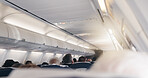Airplane, cabin and people in row for tourism with flying, transportation services or global journey. Plane, group and passenger on international trip, back or relax with airline on flight for travel