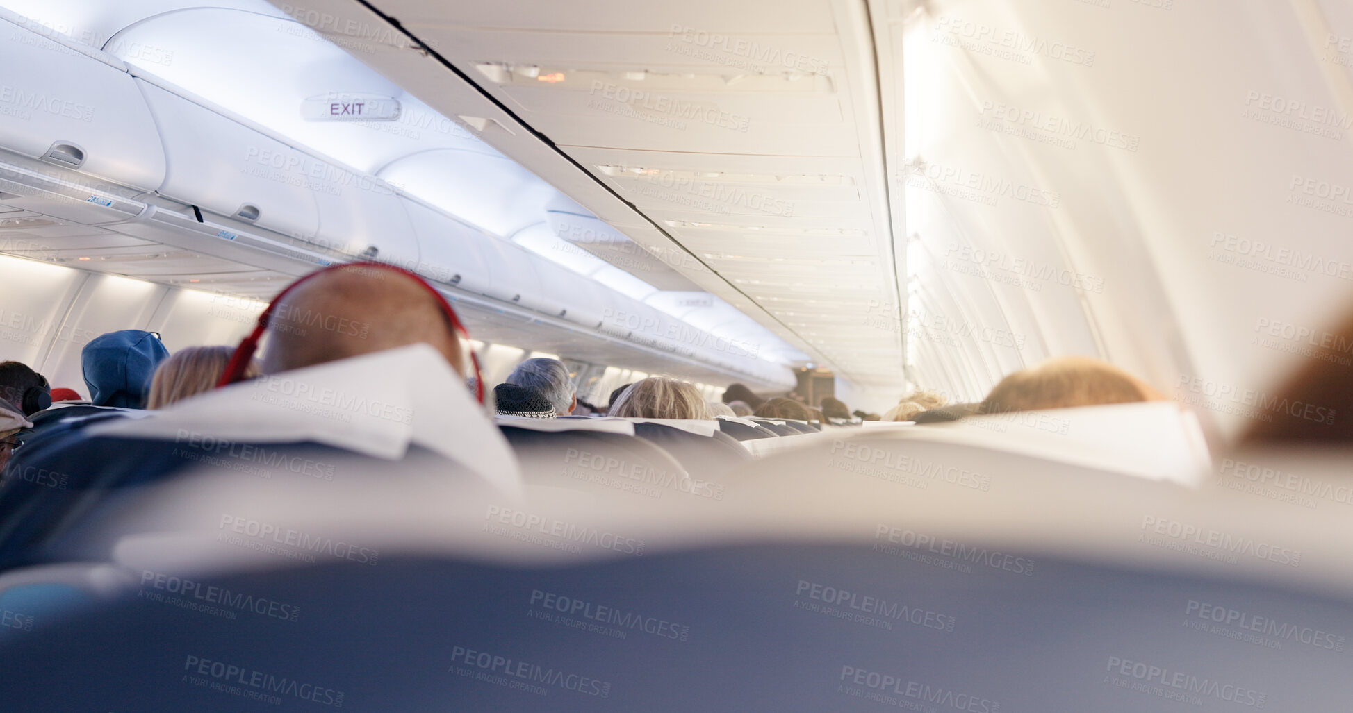 Buy stock photo Airplane, cabin and people in row for trip with flying, transportation services or global journey. Plane, group and passenger on international flight, tourism or relax with back on airline for travel