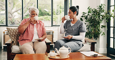 Buy stock photo Caregiver, relax and drinking tea in nursing home with old woman, visit and support for bonding together. People, senior person and nurse in retirement center with beverage, consultation and checkup.