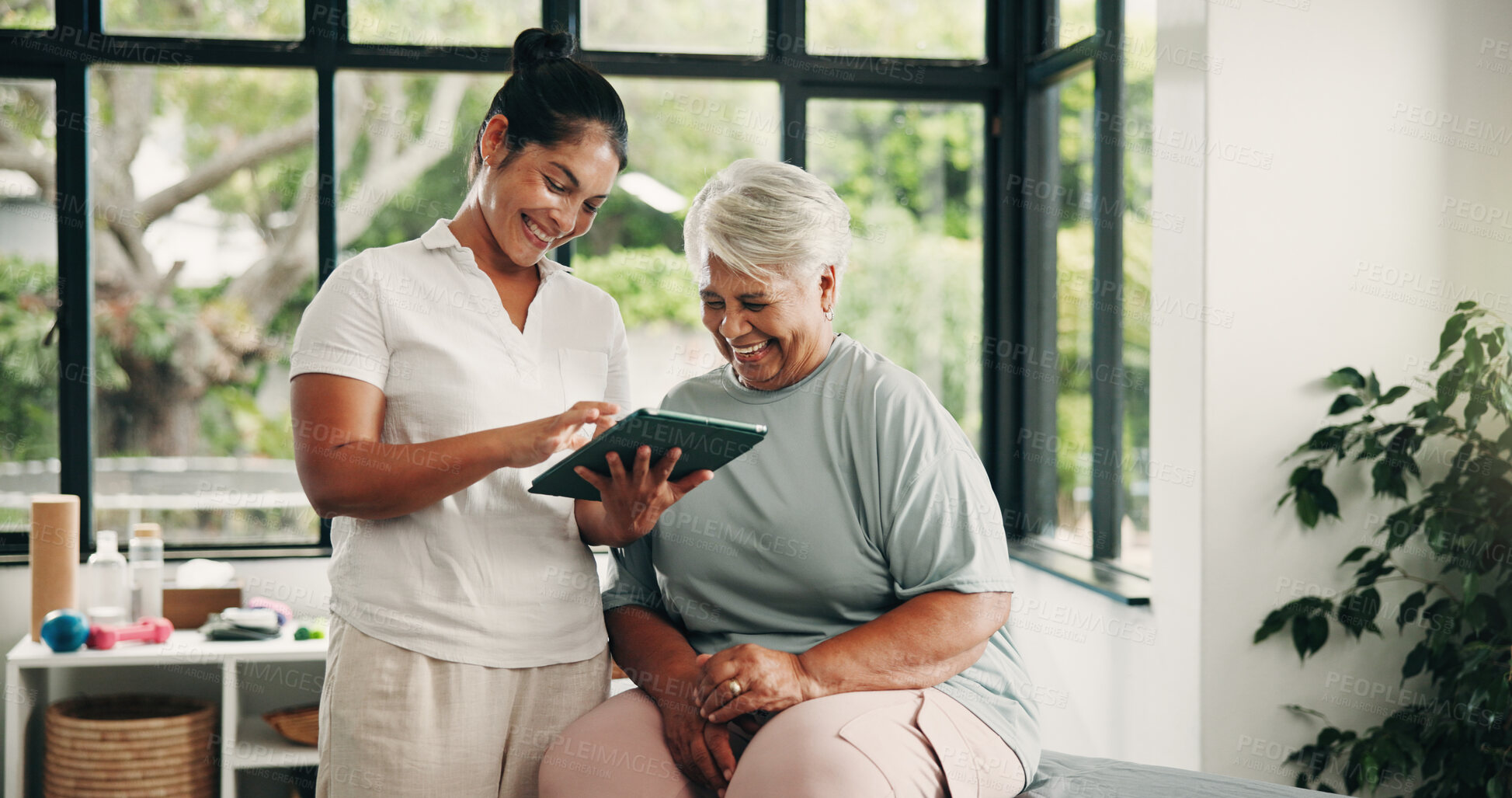 Buy stock photo Tablet, physiotherapist and old woman in consultation, laugh and medical results in clinic. Tech, physical therapy or senior patient with chiropractor for healthcare recovery, rehabilitation or funny