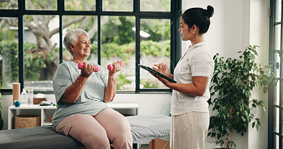 Buy stock photo Tablet, physical therapist and old woman with dumbbells, fitness and exercise in clinic. Tech, physiotherapy and weightlifting with senior patient for muscle recovery, rehabilitation and smile
