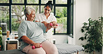 Physiotherapy, dumbbells or senior woman in clinic, medical recovery evaluation or arm exercise. Help, specialist or old person with injury assessment for healing progress, weights or strength test