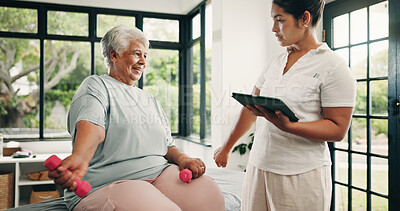 Buy stock photo Physical therapy, tablet and old woman with dumbbells, fitness and training for wellness and workout. Happy, senior person and physiotherapist with tech for health progress or exercise in clinic