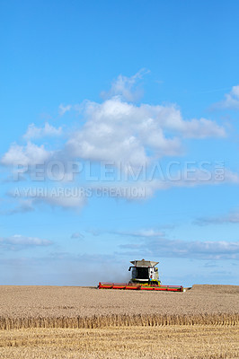 Buy stock photo Harvester, tractor and agriculture for crops at farm with sky, clouds or horizon for organic food production. Vehicle, machine and wheat field with equipment, grain and landscape in countryside