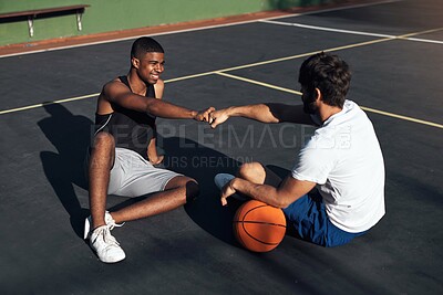 Buy stock photo Happy, men or friends on basketball court with fist bump, exercise rest or training support for fitness. People, smile and workout break outdoor with wellness, respect or teamwork for sports practice
