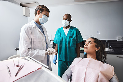 Buy stock photo Talking, consulting and woman with dentist in chair for teeth cleaning, oral hygiene and treatment. Healthcare, clinic and orthodontist with patient for dental care, whitening and medical service
