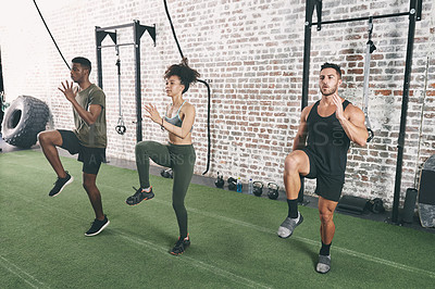 Buy stock photo Gym, exercise and group of people with leg workout, bodybuilder training and fitness. Class, instructor and men with woman in sports center for knee lifts, muscle strength and mobility for health