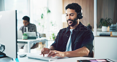 Buy stock photo Call center, computer and man in office, typing for customer service and headset for communication. Person, employee and consultant in workplace, pc or discussion for application or online assistance