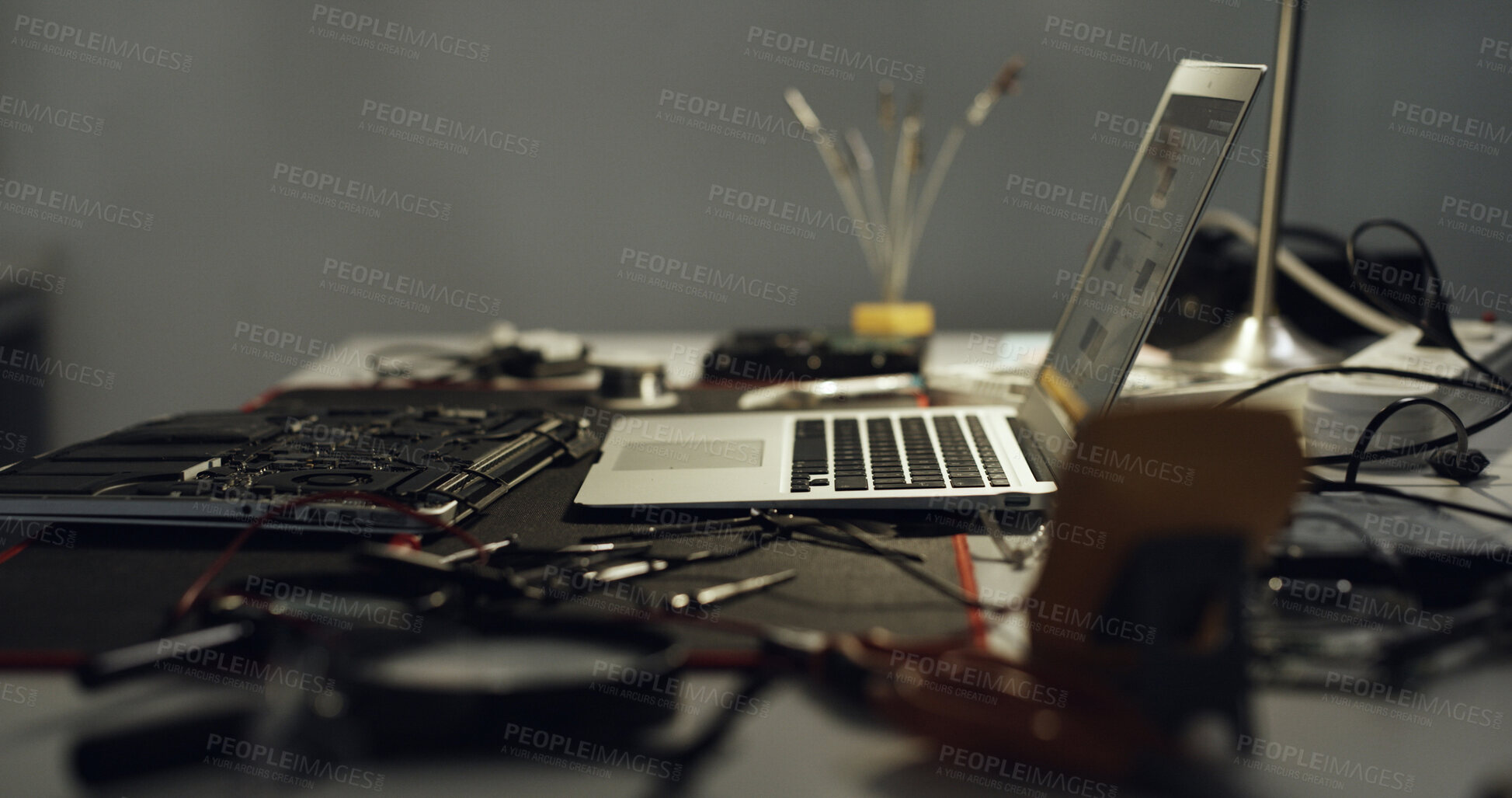 Buy stock photo Laptop, repair and work desk with components for electronic maintenance or fix in workshop. Empty, computer or IT engineering with equipment for problem solving, troubleshooting or circuit testing