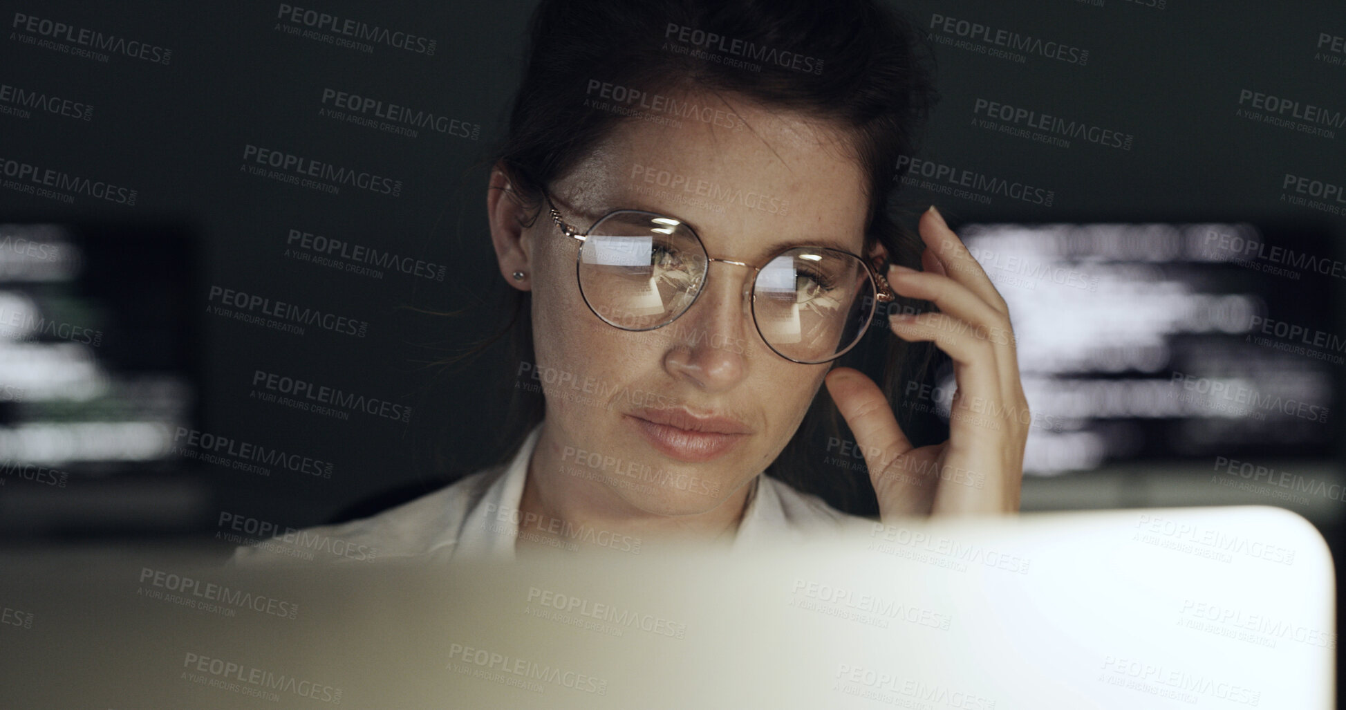 Buy stock photo Glasses, reading and business woman with laptop for programming, software or web design solution. Programmer, reflection and technology for IT problem solving, maintenance results or coding at night