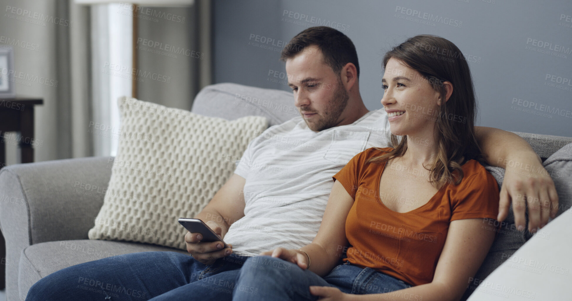 Buy stock photo Cellphone, relax and couple on sofa in home with texting, networking or chatting on mobile app. Technology, happy and man with woman on phone for social media together in living room at house.