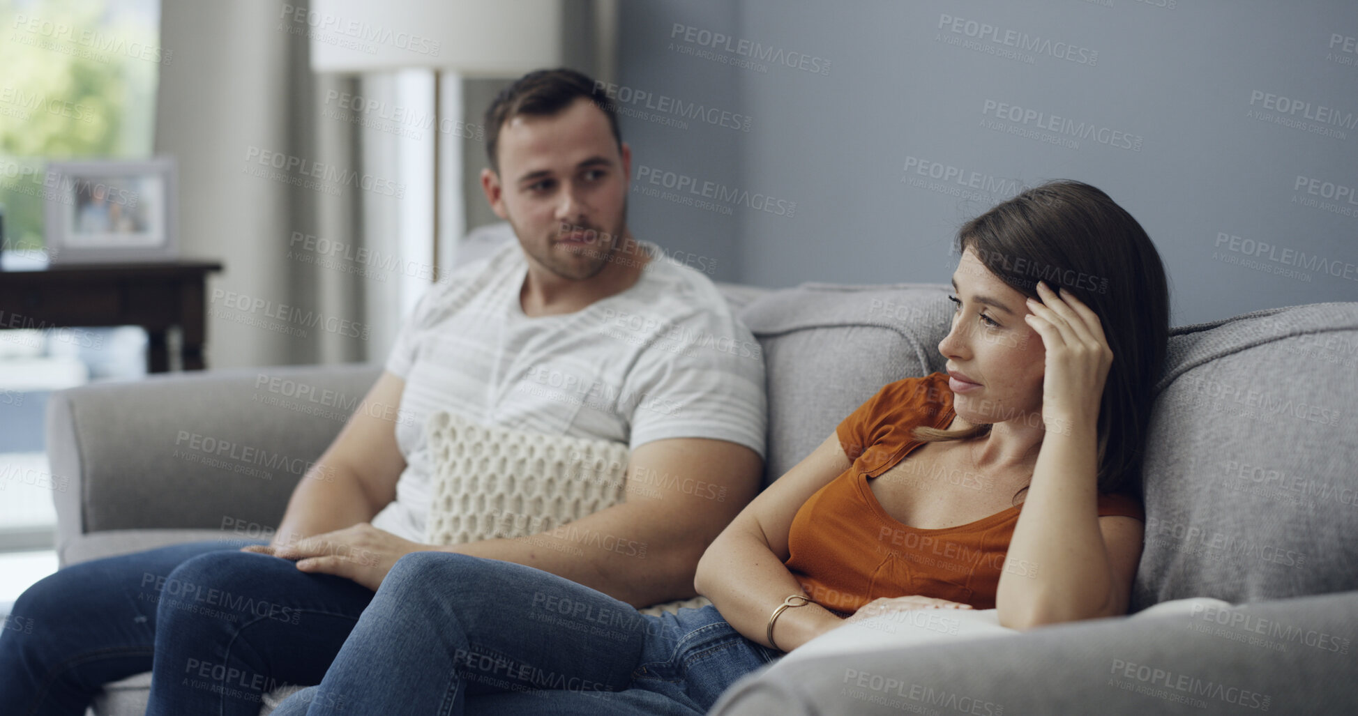 Buy stock photo Argument, talking and couple on sofa in home with relationship problem, cheating or affair conflict. Fighting, conversation and man with woman for marriage disagreement in living room at apartment.