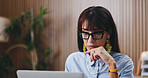 Reading, glasses and businesswoman with laptop, office or mature attorney with legal research on web. Corporate, lawyer and person with eyewear in law firm, serious and case review with technology