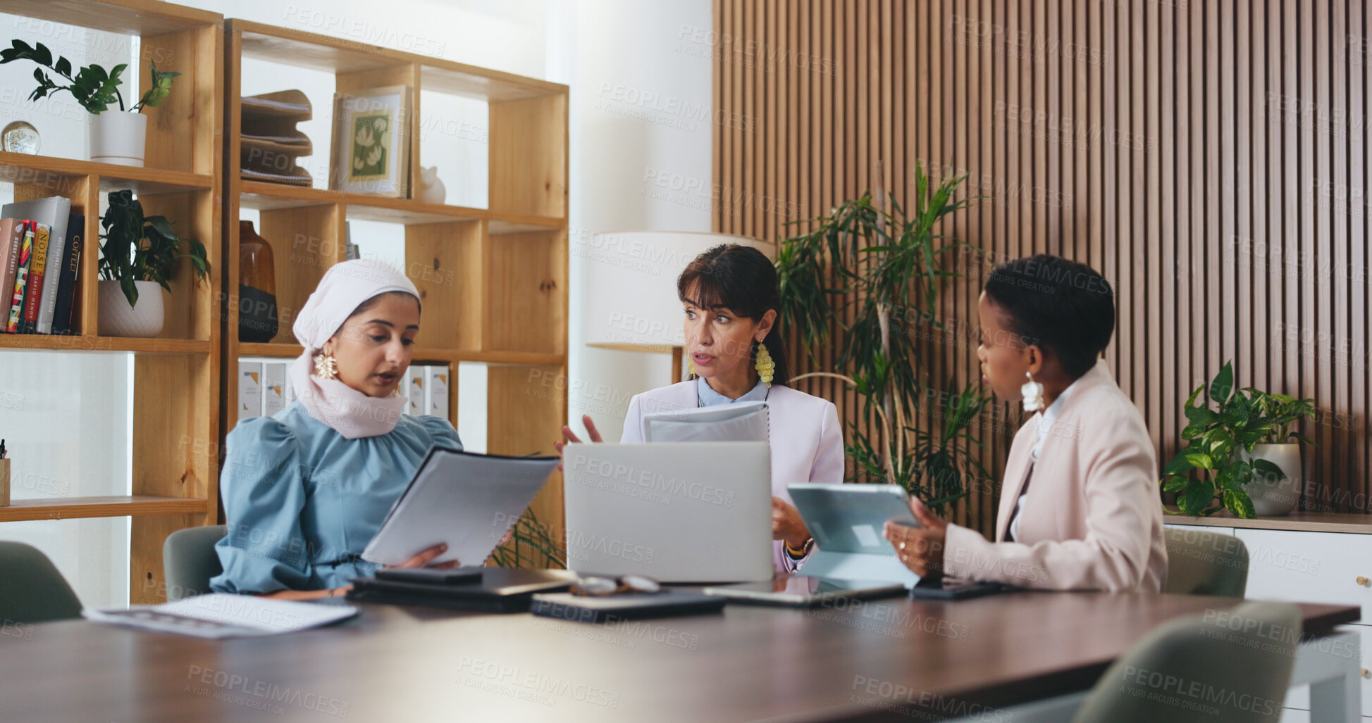 Buy stock photo Woman, laptop and documents with team in office meeting for strategy, tablet and insight at insurance company. Person, broker and diversity with tech on app, feedback or risk management at agency