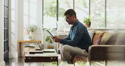 Buy stock photo Typing, remote work and man with tablet in home office for account manager, client portfolio and research. Admin, feedback and technology with person in living room for planning or thinking in house
