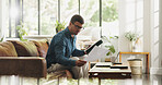 Typing, remote work and man with tablet in house for account manager, client portfolio and research. Admin, feedback and paperwork with person in living room for planning or thinking in home office