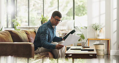 Buy stock photo Document, remote work and man with tablet in house for account manager, client portfolio and research. Admin, feedback and paperwork with person in living room for planning or reading in home office