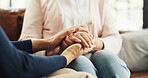 Sofa, person and holding hands with senior mom for diagnosis news, emotional support and empathy. Love, people and elderly mother with comfort in retirement home for medical results, console or trust