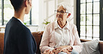 Conversation, volunteer and senior woman in living room for rehabilitation, checkup and post surgery recovery. Apartment, pensioner or elderly person in home for support, chat and advice for help