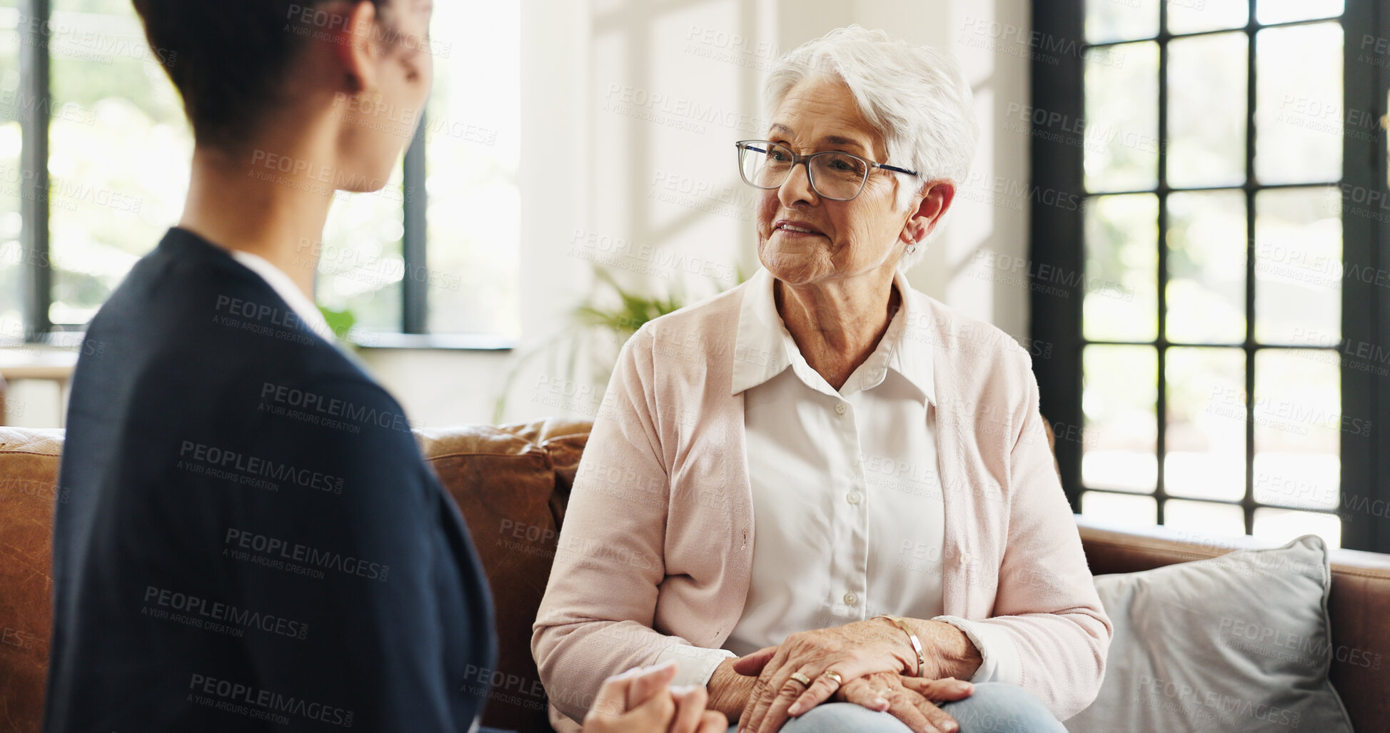 Buy stock photo Conversation, volunteer and senior woman in living room for rehabilitation, checkup and post surgery recovery. Apartment, pensioner or elderly person in home for support, chat and advice for help