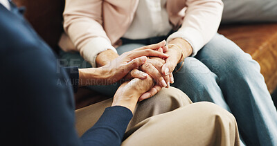 Buy stock photo Care, friends and holding hands on sofa in home for emotional support, grief and comfort. Trust, understanding and console person with depression in living room for mourning, compassion and sympathy