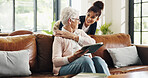 Happy, caregiver and old woman with tablet, lounge and bonding with patient on break or hug in home. Online, entertainment and senior person with tech for movies, retirement and embrace with nurse