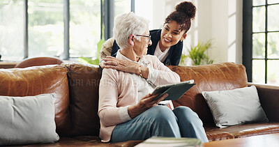Buy stock photo Happy, caregiver and old woman with tablet, lounge and bonding with patient on break or hug in home. Online, entertainment and senior person with tech for movies, retirement and embrace with nurse