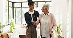 Nurse, old woman and help with walking stick in home for mobility, smile and support in retirement. People, caregiver and elderly patient with disability, cane or holding hands for rehabilitation