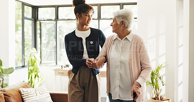 Buy stock photo Nurse, old woman and help with walking stick in home for mobility, smile and support in retirement. Patient, caregiver and elderly person with disability, cane or holding hands for rehabilitation