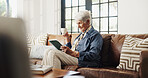 Coffee, tablet and elderly woman in home for reading news, email or relax on sofa in retirement. Tea, technology and senior person in living room for online article, ebook or happiness on weekend