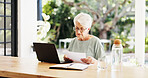 Old woman, documents and laptop in home for finance with glasses, budget or report in living room. Elderly person, computer and investment admin for asset management, paperwork or retirement at house