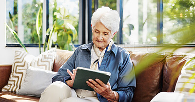Buy stock photo Old woman, tablet and relax on couch with typing in home, smile and search for ebook in retirement. Elderly person, happy and tech on sofa with application, scroll or streaming in lounge at house