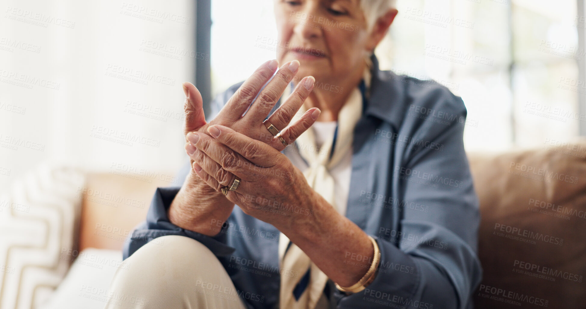 Buy stock photo Hands, wrist pain and injury in home for retirement with fatigue, arthritis or carpal tunnel in lounge. Elderly woman, joint ache and fibromyalgia on sofa, muscle inflammation or strain at house