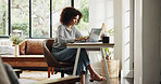 Creative, online and woman with laptop, home office and planning for article, serious or journalism. Reporter, typing and person with tech for project, remote work and magazine publication in house