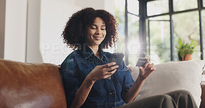 Buy stock photo Credit card, happy and black woman with phone on sofa for online shopping, purchase and payment. Home, ecommerce and person with smartphone on bank app for subscription, website sale and transaction