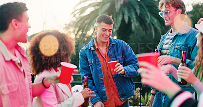 Buy stock photo Drink, fun and party with friends outdoor together for bonding, celebration or social gathering. Alcohol, dance and reunion with group of people in backyard of home for energy, holiday or weekend