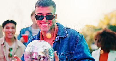 Buy stock photo Friends, sunglasses and happy man with disco ball at party, social event and get together for reunion. Smile, shades and person with group for weekend bonding, outdoor rave and summer festival fun