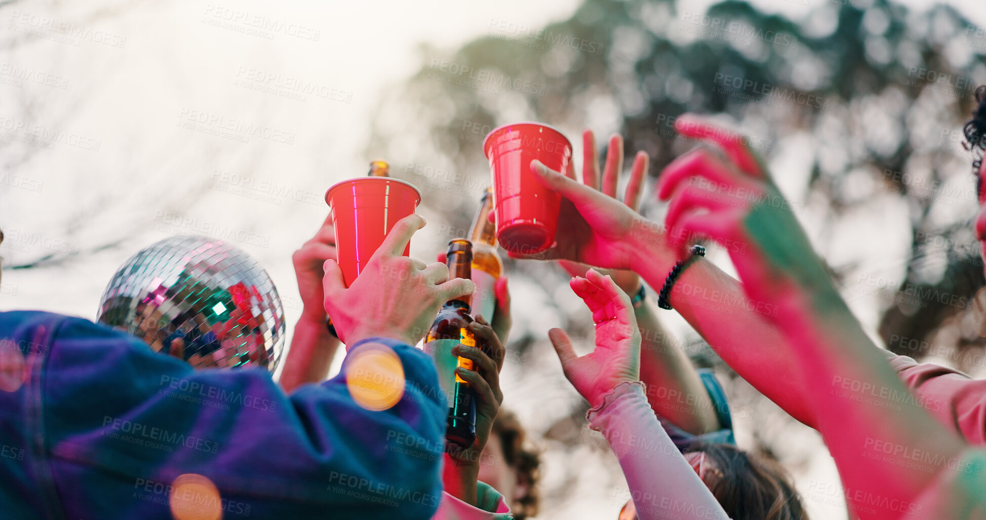 Buy stock photo Celebration, toast or hands outdoor with alcohol, reunion or bonding together at friendship event. Gen z, below or people in park with cups, birthday party or drinks cheers in social gathering.