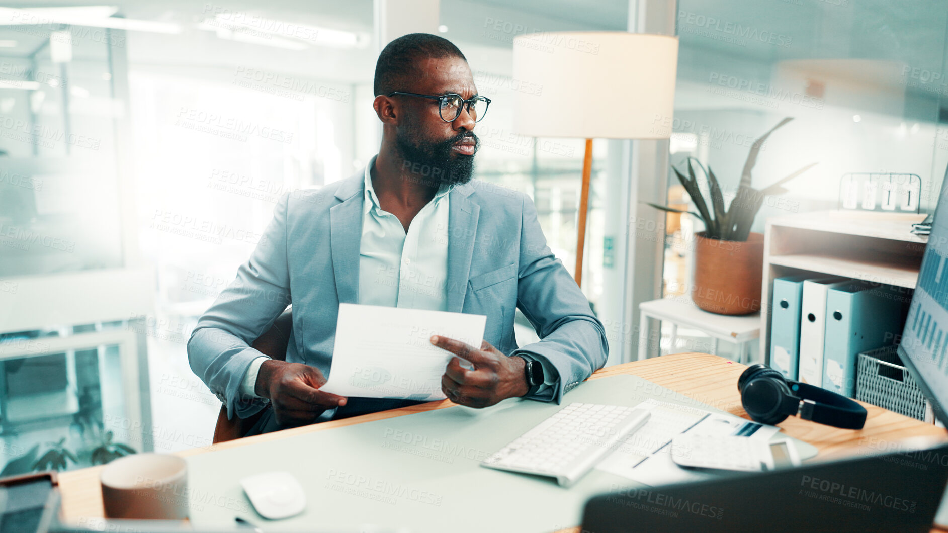 Buy stock photo Black man, paperwork and stress with computer at office with glasses, review or flare at investment company. African person, broker and frustrated with glitch, mistake and report at finance agency
