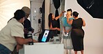 Preparation, photoshoot and people on set with makeup, getting ready and beauty check in studio. Collaboration, model or film team with cosmetics, fashion catalog or backstage in media production.