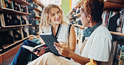 Buy stock photo Tablet, women and students in library, talking and ideas for academic project, smile and college. University, friends or people on floor, conversation or tech for online course, research or education