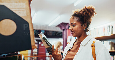 Buy stock photo Student, girl and reading book at shelf at college for research, exam info and knowledge. University, african person and check resources in library for thesis citation, literary interest and learning