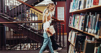 Mother, daughter and walk in library with book, knowledge support or bonding together for development. Happy, mom and child search in bookshop for english literature, education or guidance for growth