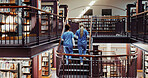 Medical, students and women in library for education, learning and girls walk on stairs in college. University, nurses and friends on steps for healthcare, scholarship and back for development