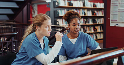 Buy stock photo Girl, medical students and planning with laptop at library for research, talk and education at campus. Women, healthcare scholarship and conservation with project, explain and computer at university