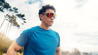 Buy stock photo Low angle, outdoor or man with workout, sunglasses for uv protection or polarized lenses. Nature, reflection or person with shield eyewear, wellness or exercise for health benefits, safety or fitness