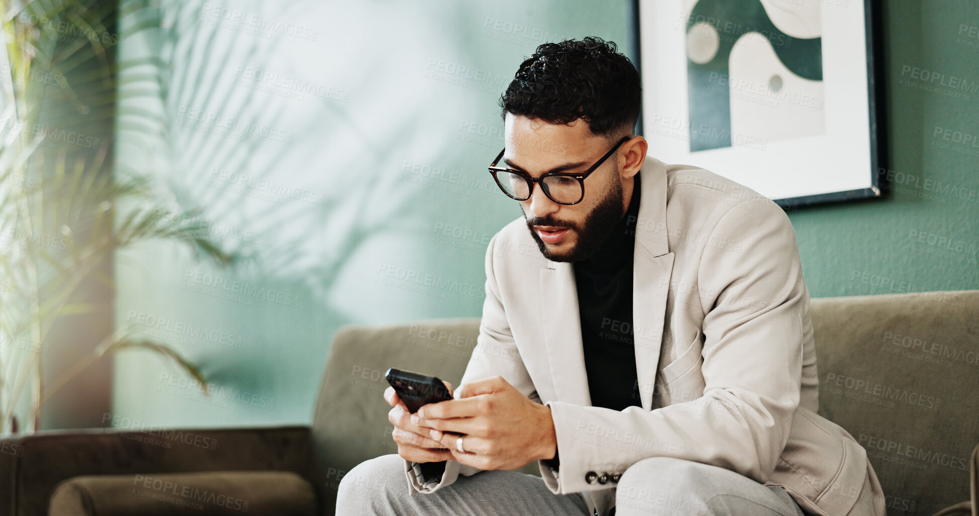 Buy stock photo Business, phone and typing with man on sofa in office for communication, text message or update. App, reading and scrolling with employee person in workplace lobby for browsing, planning or research