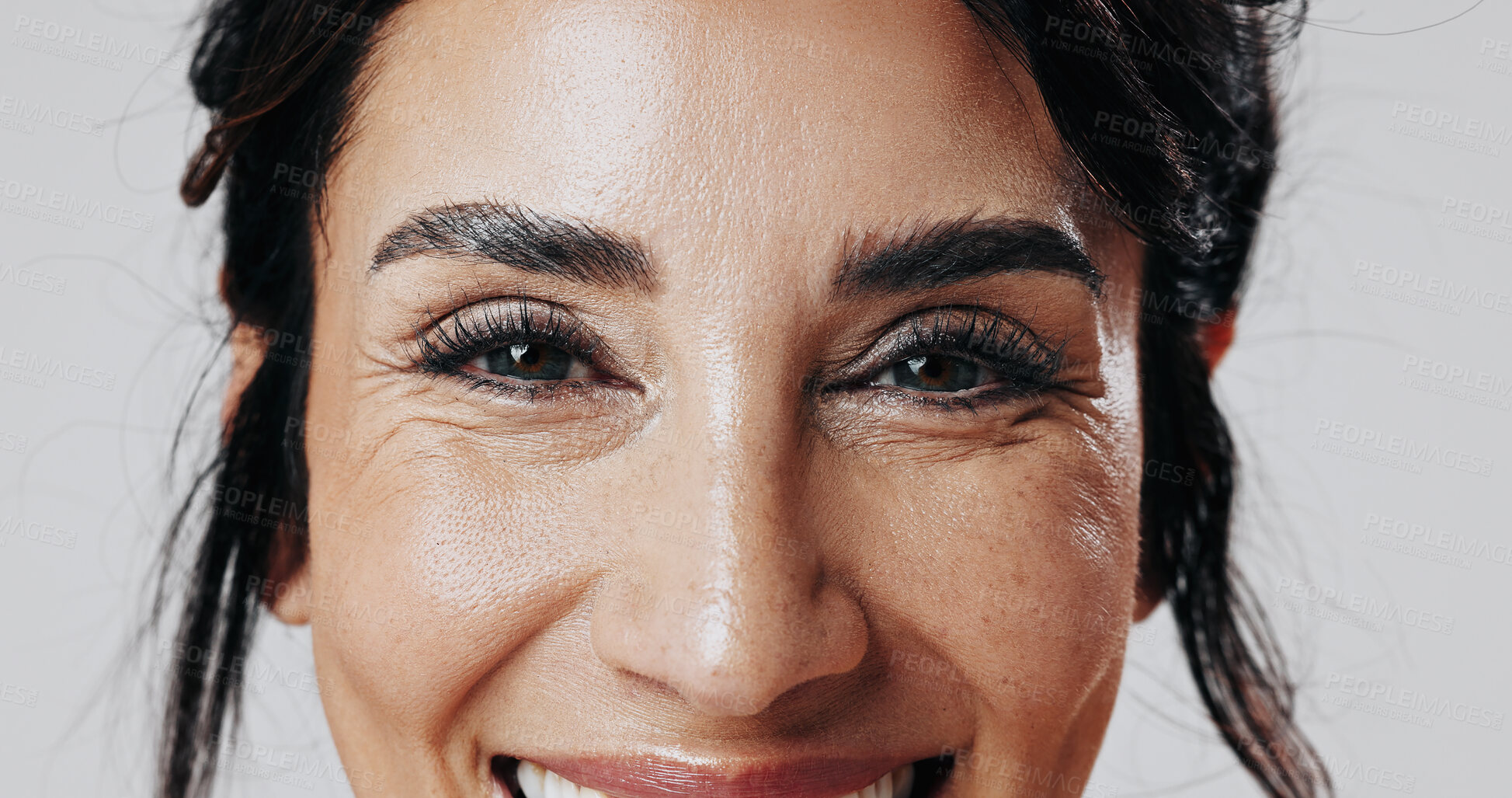 Buy stock photo Smile, woman and eyes with makeup in studio for beauty, laminated eyebrows and natural glow. Portrait, mature person and cosmetics with lash extension, facial treatment and change on white background